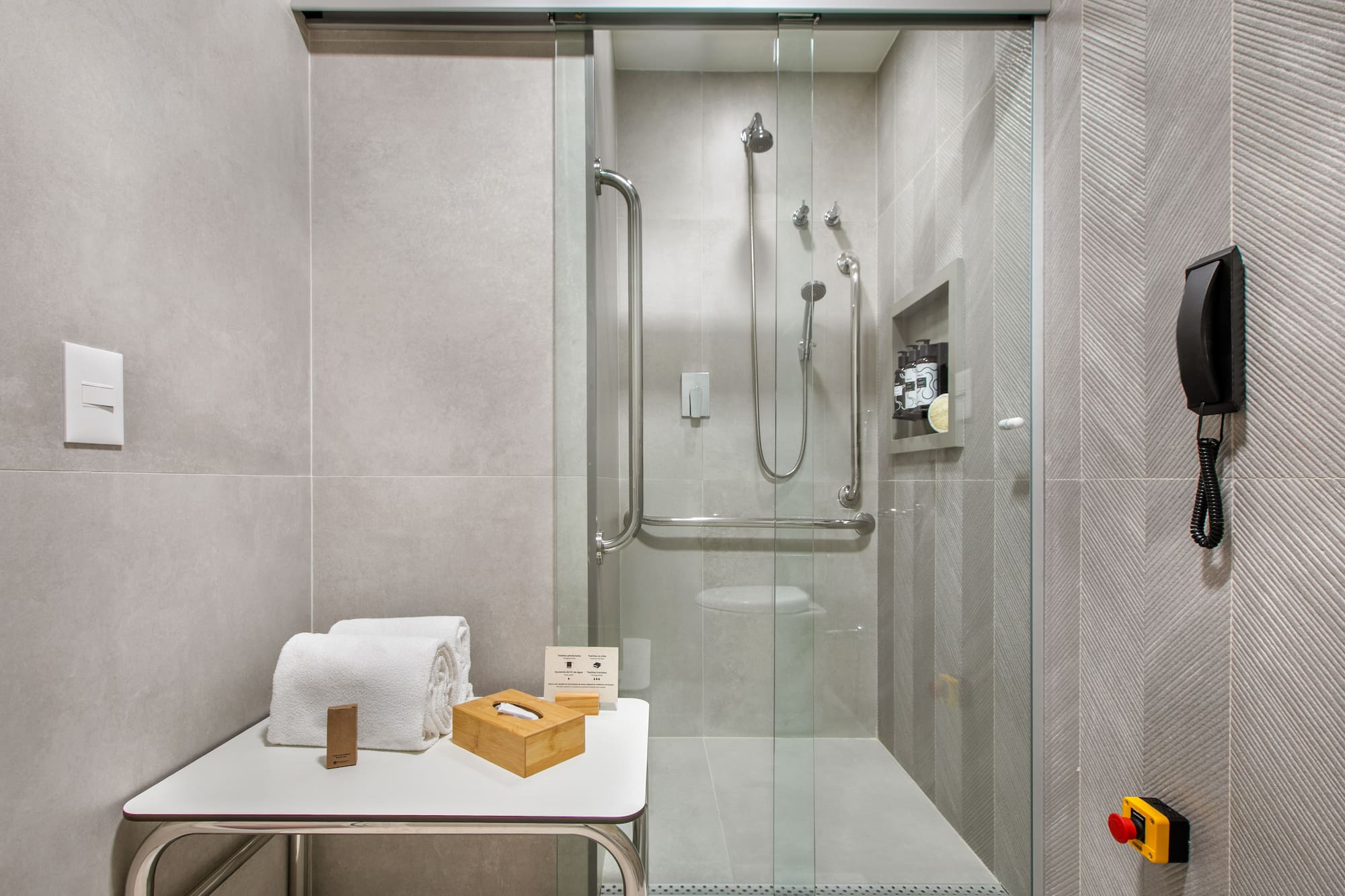 a bathroom with a glass shower door
