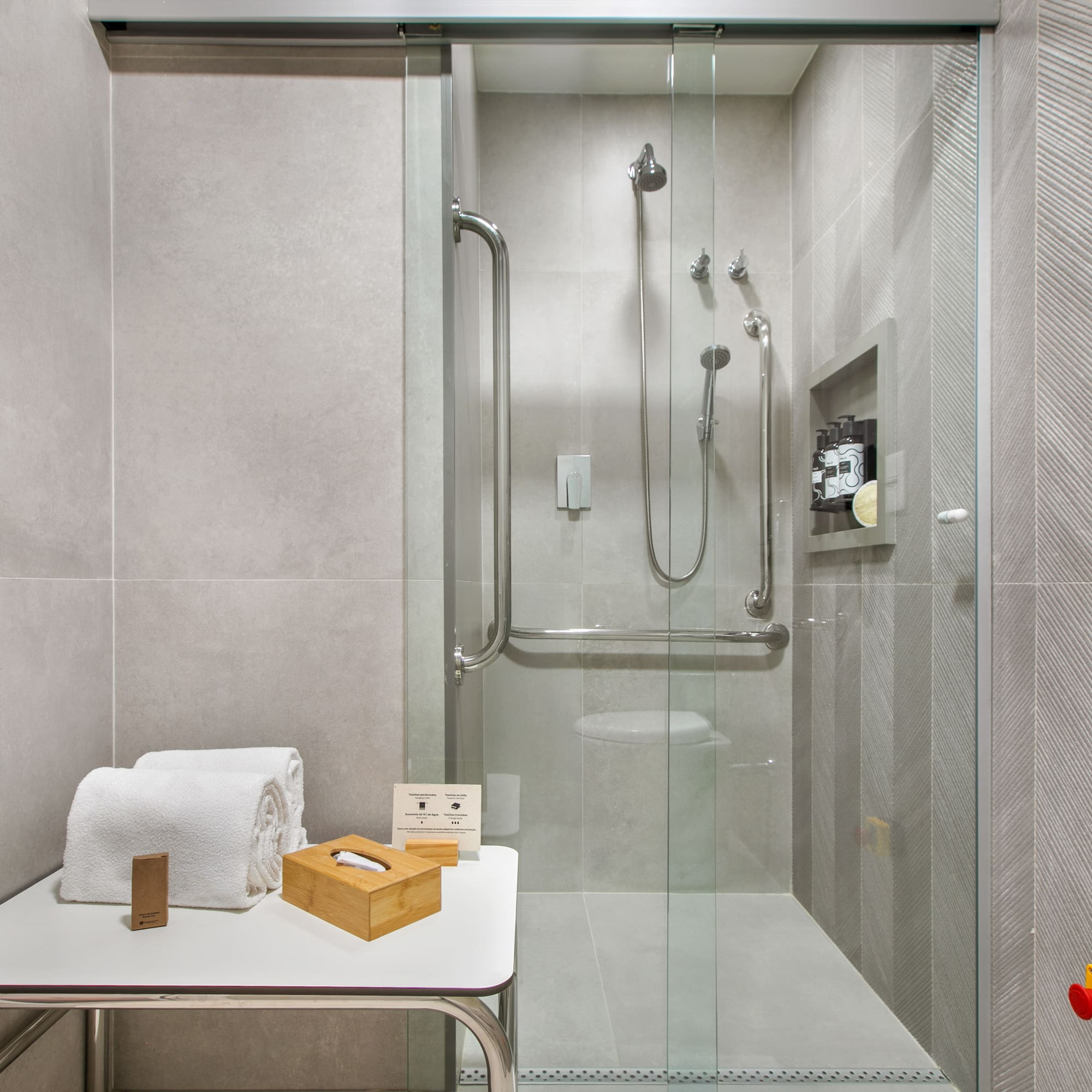 a bathroom with a glass shower door