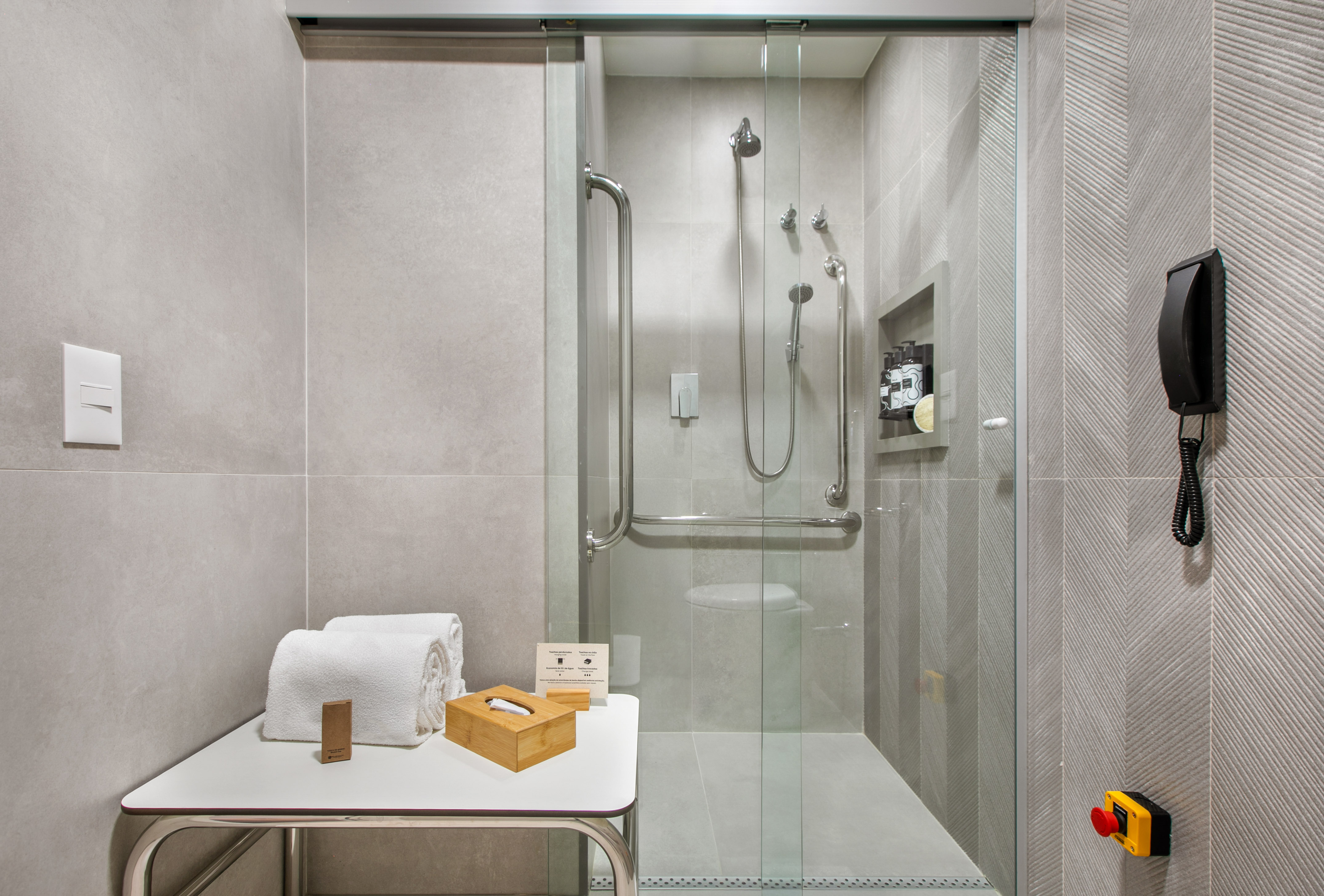 a bathroom with a glass shower door