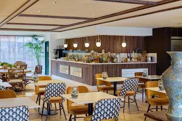 a restaurant with tables and chairs