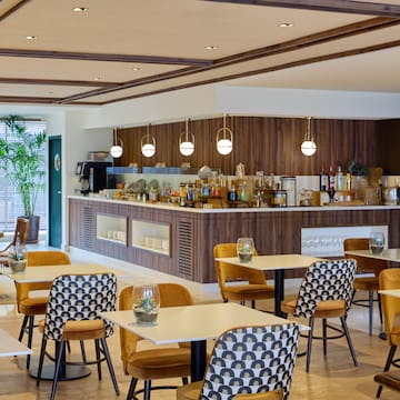 a restaurant with tables and chairs