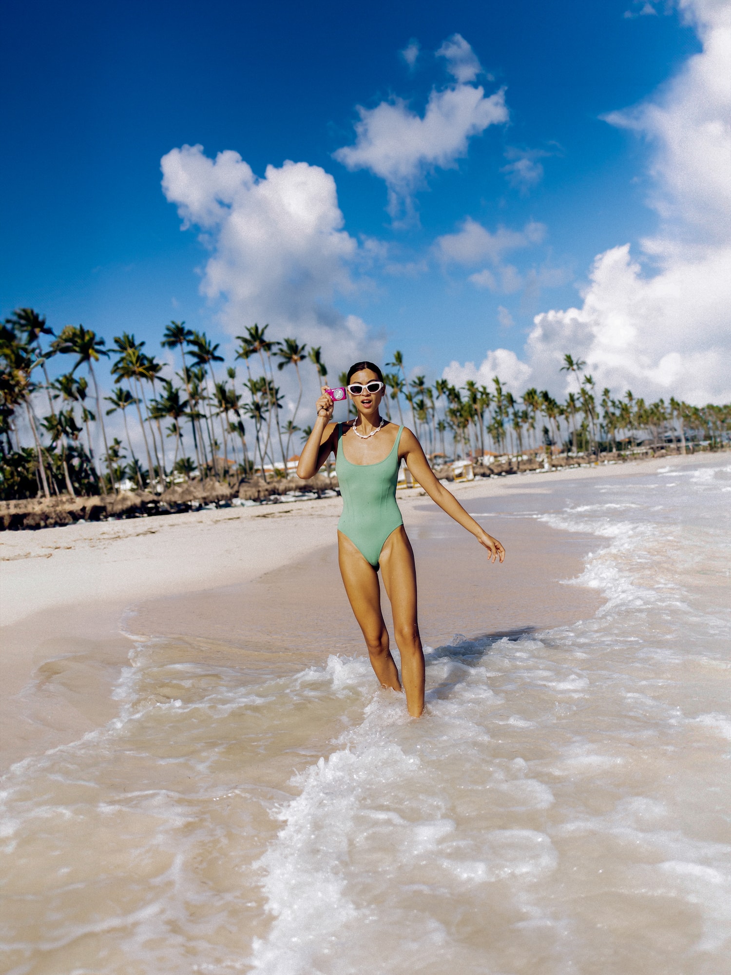 a woman in a swimsuit on a beach