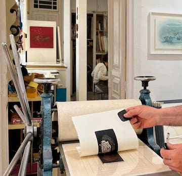 a person holding a black and white photo