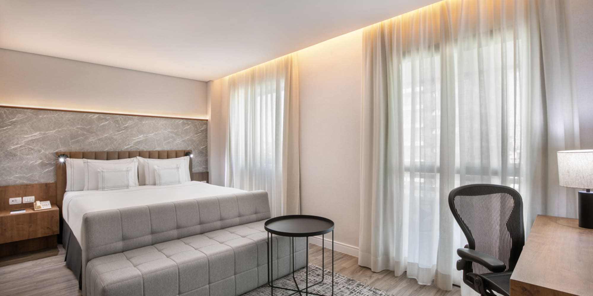 a room with a bed and a chair