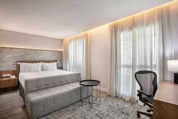 a room with a bed and a chair