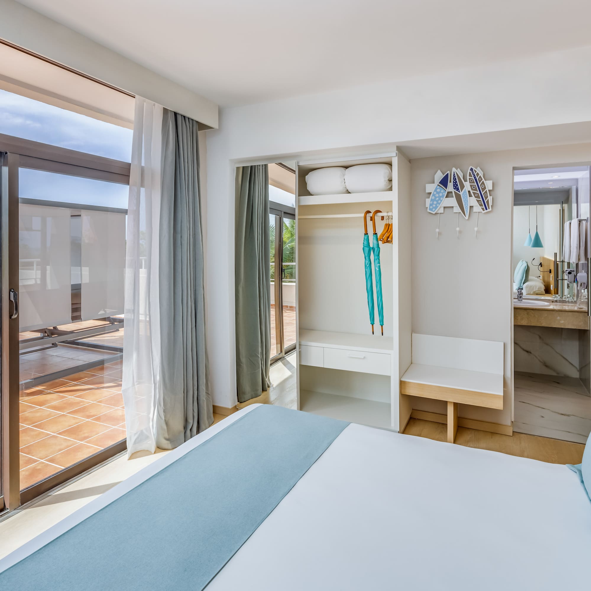 a bedroom with a bed and a sliding glass door
