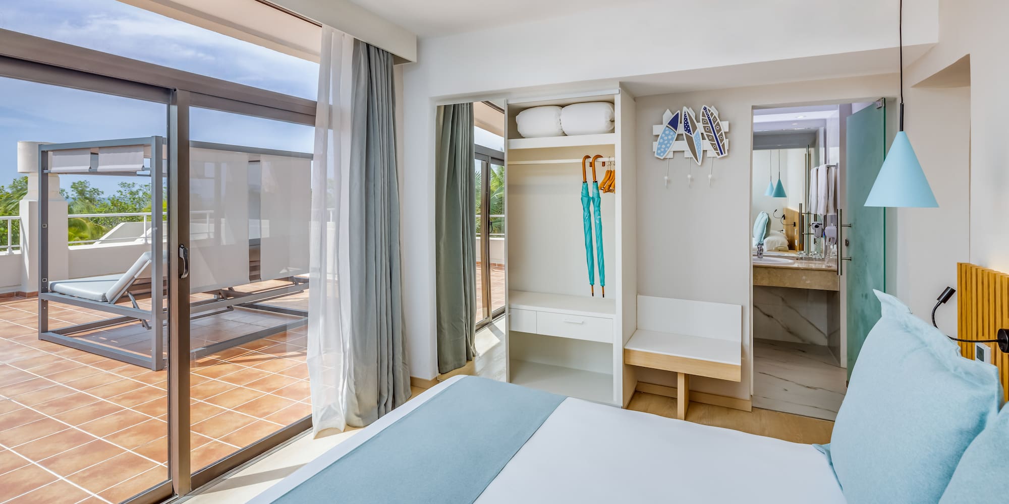 a bedroom with a bed and a sliding glass door