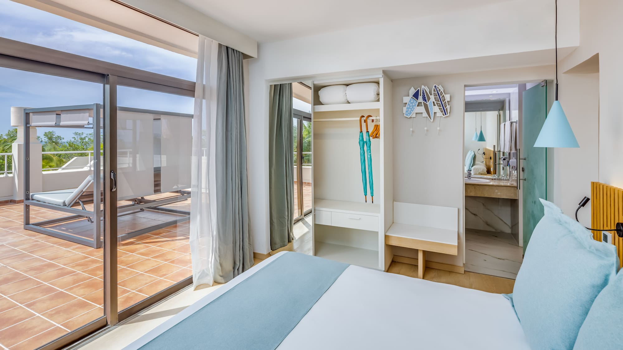 a bedroom with a bed and a sliding glass door