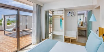 a bedroom with a bed and a sliding glass door