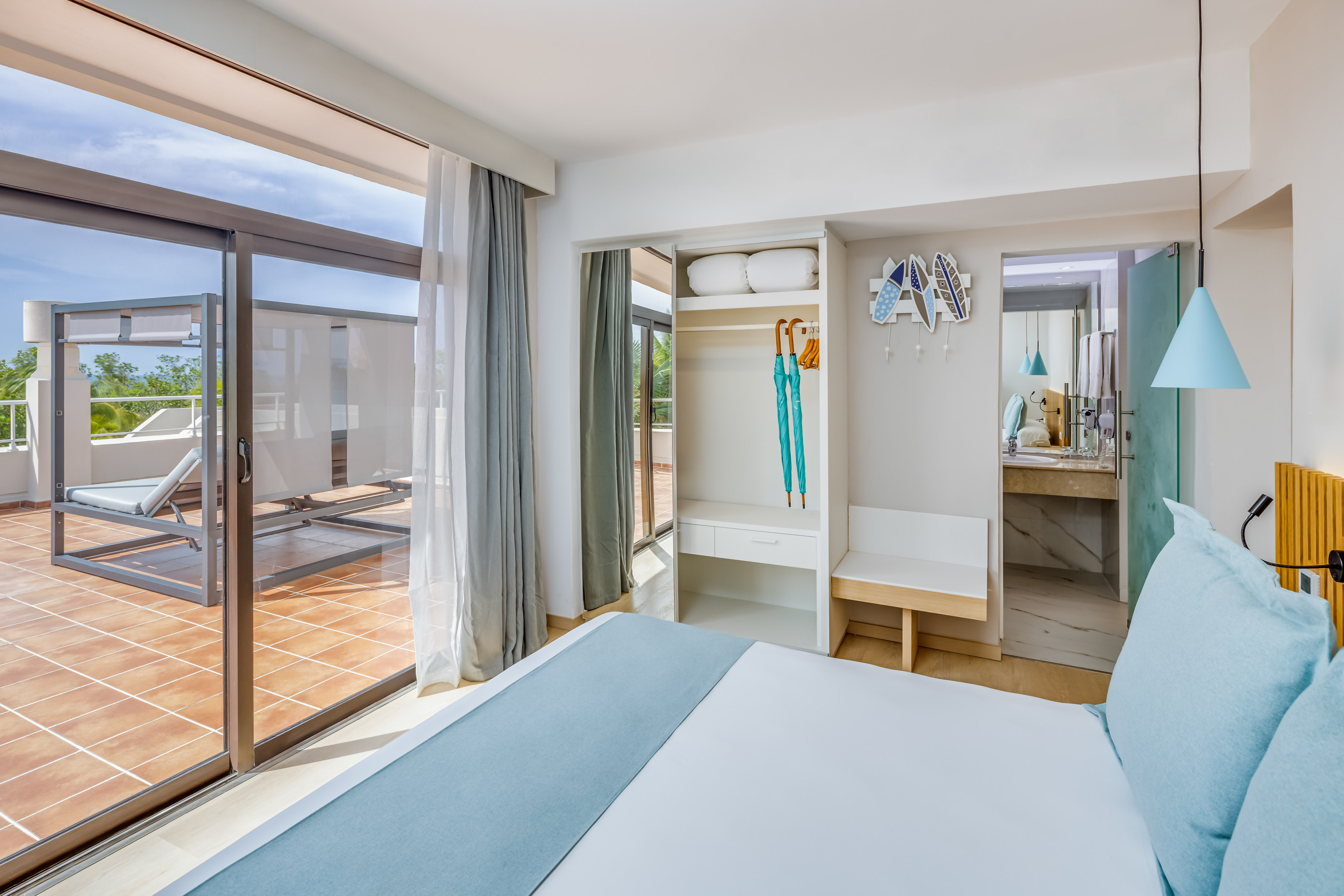 a bedroom with a bed and a sliding glass door