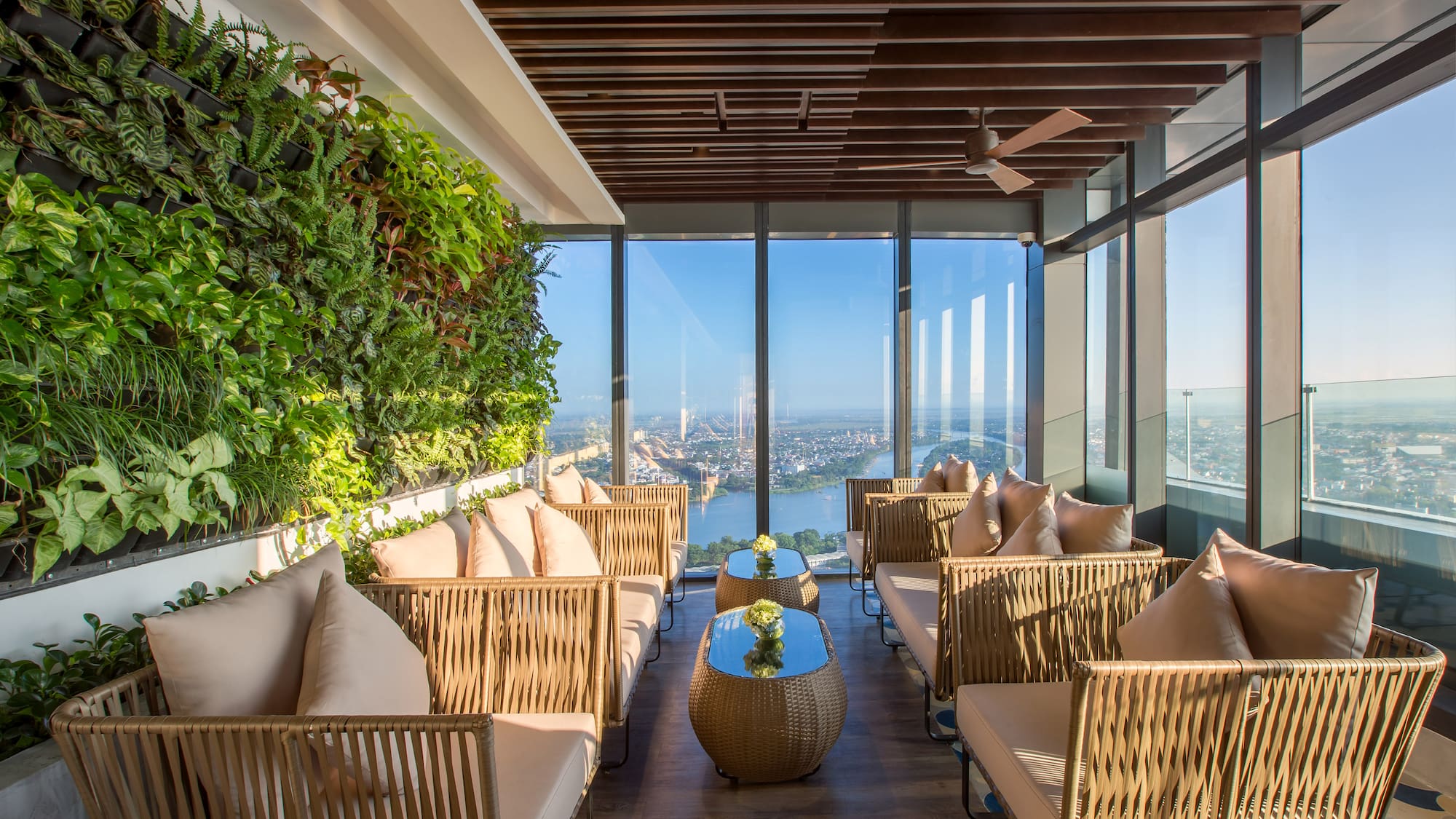 a room with a view of a city and a river
