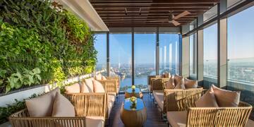 a room with a view of a city and a river