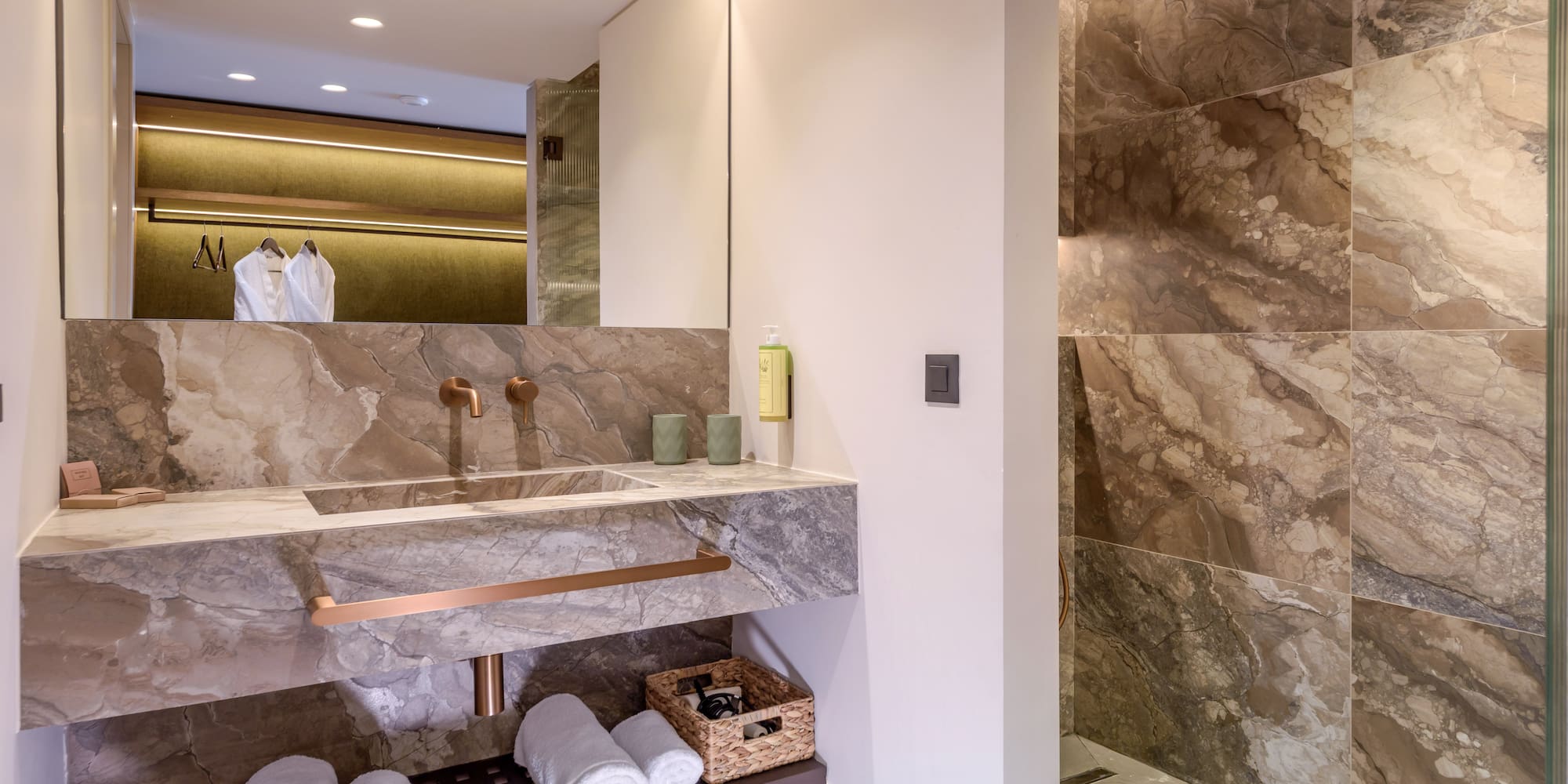 a bathroom with marble walls and a sink.