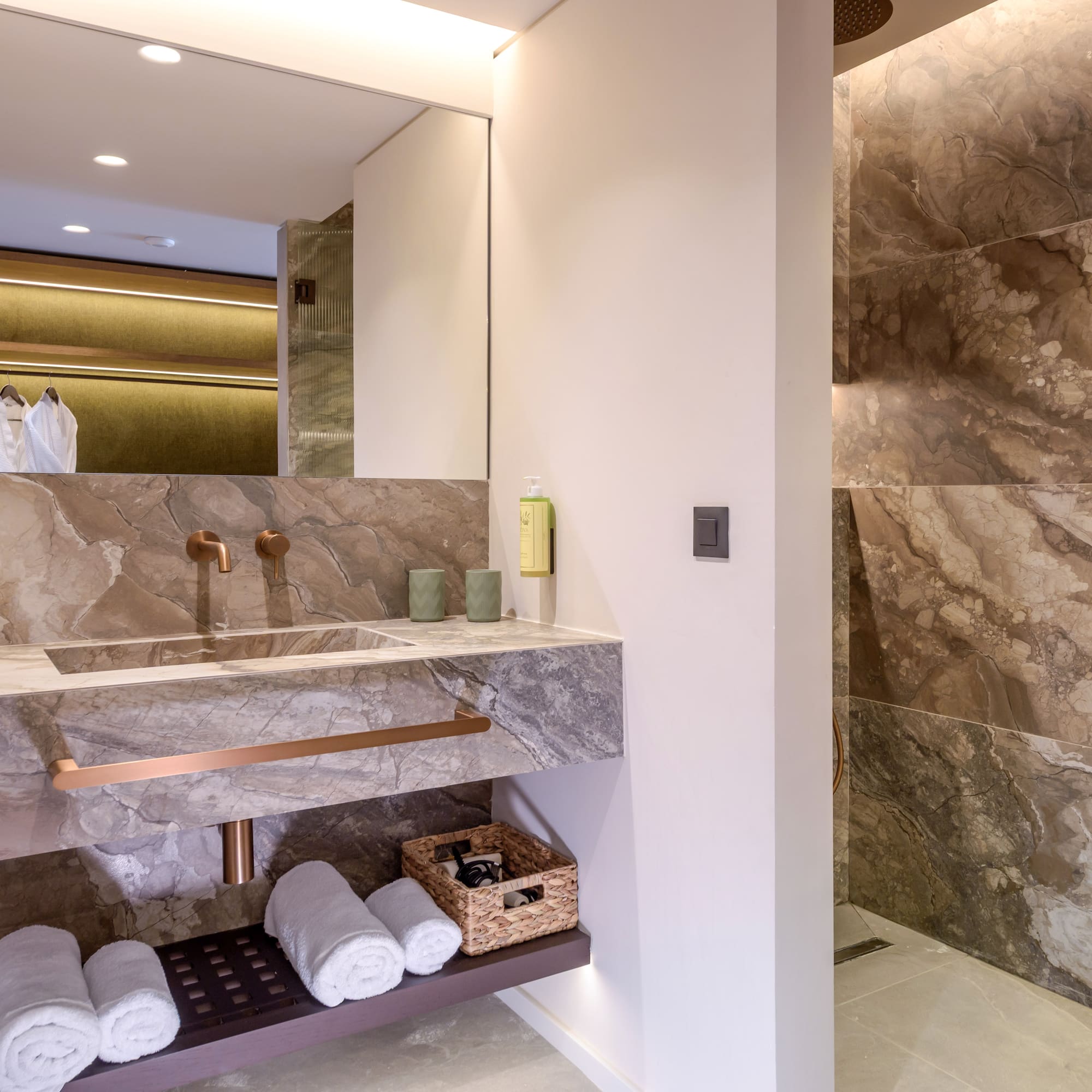 a bathroom with marble walls and a sink.