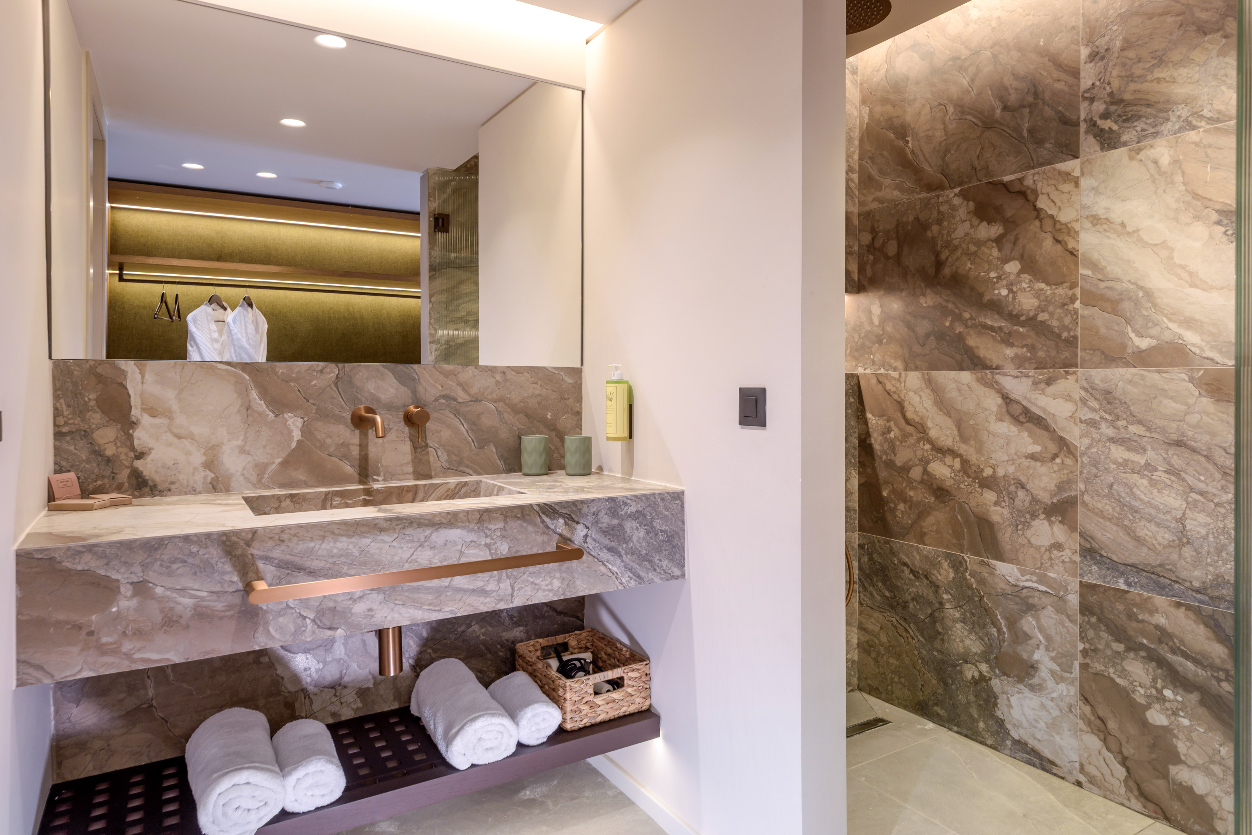 a bathroom with marble walls and a sink.