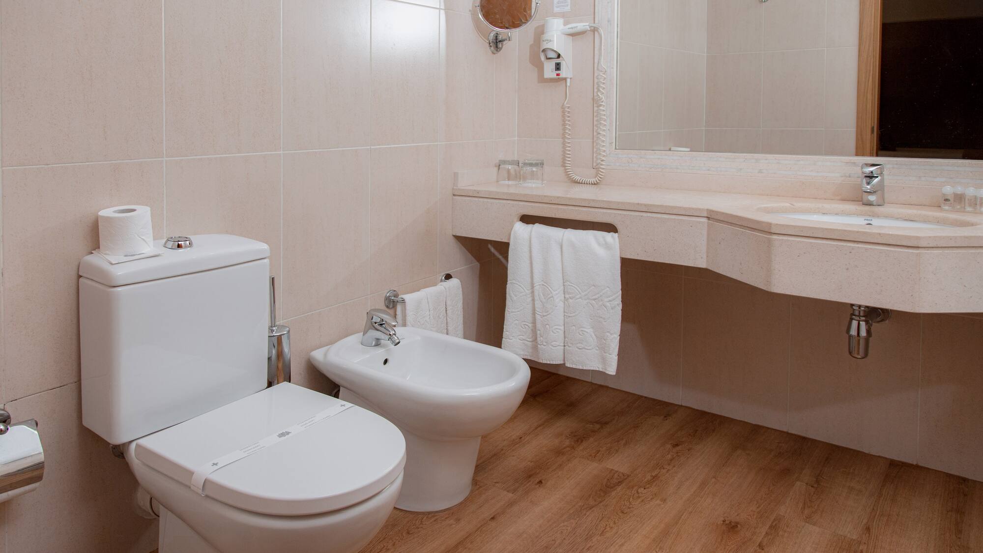 a bathroom with a toilet and sink