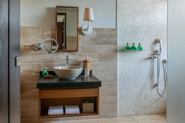 a bathroom with a sink and shower