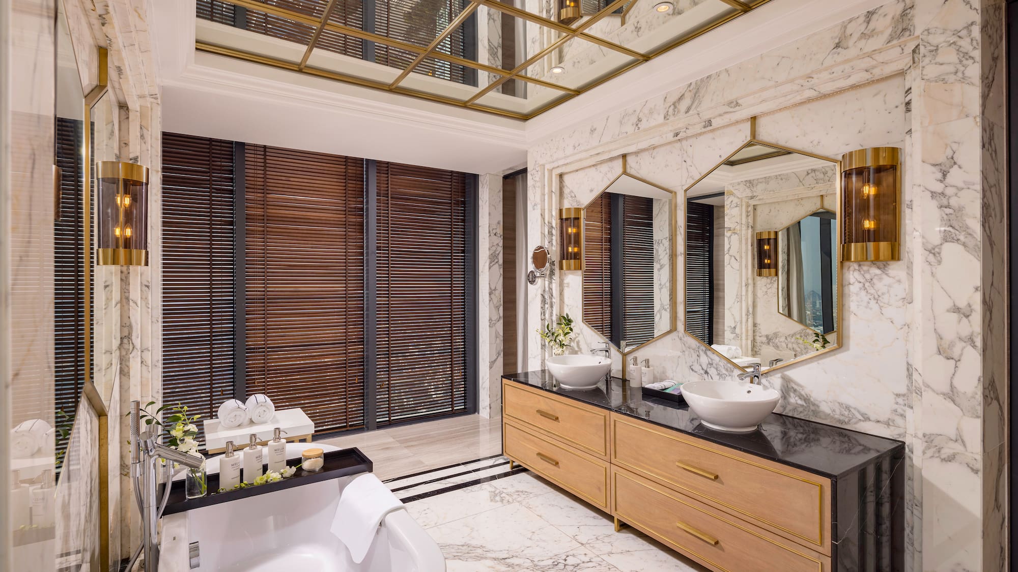 a bathroom with a large mirror and a tub