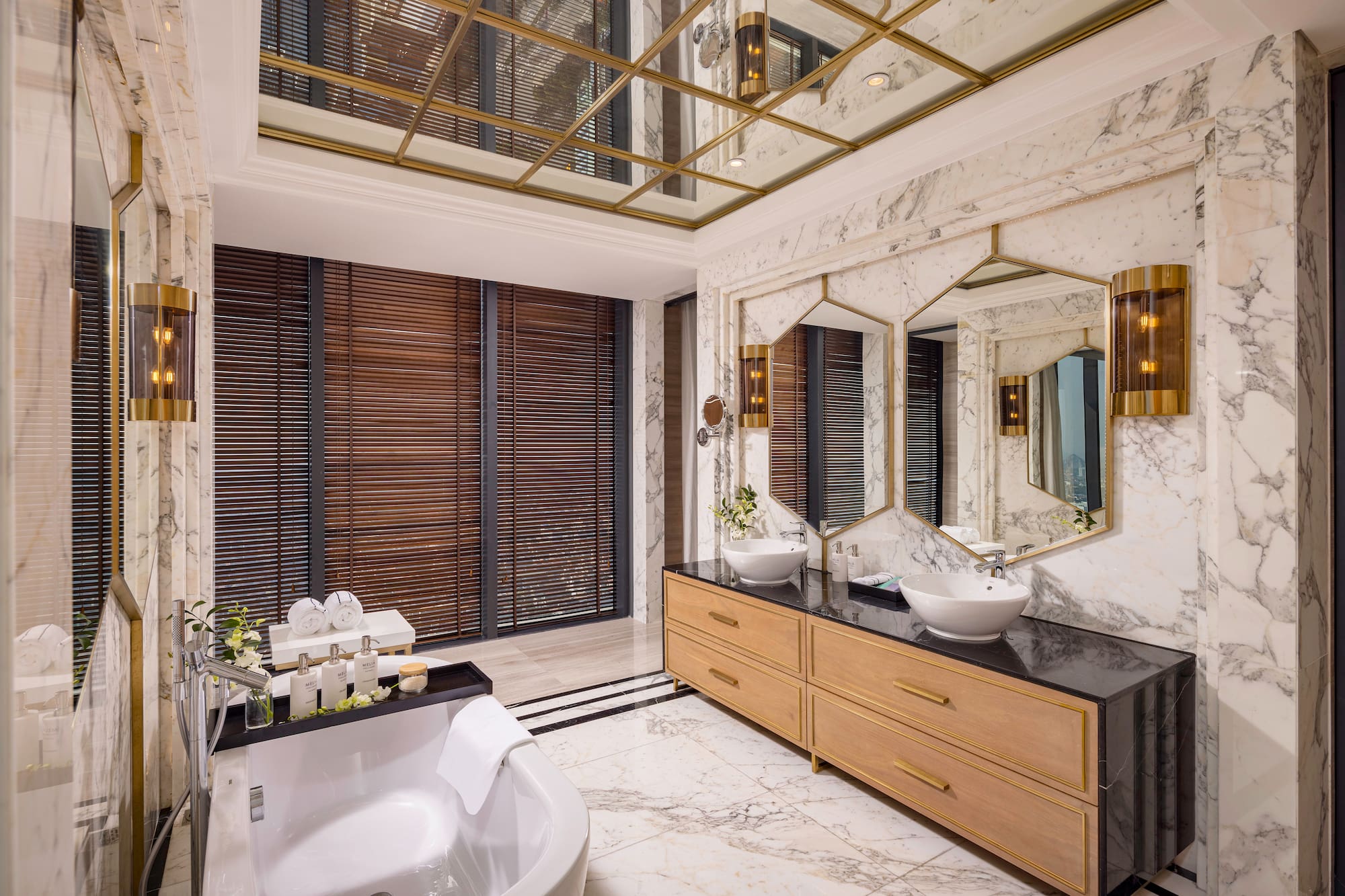 a bathroom with a large mirror and a tub