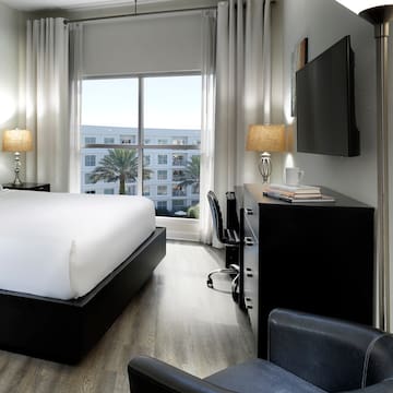 a room with a bed and a tv