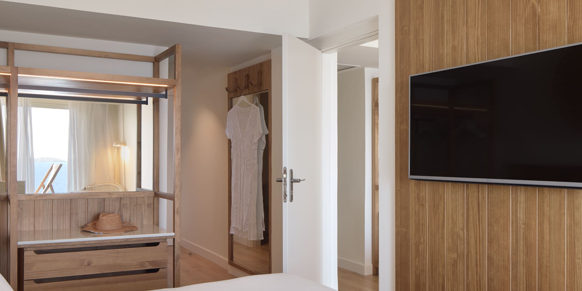 a room with a tv and a bed