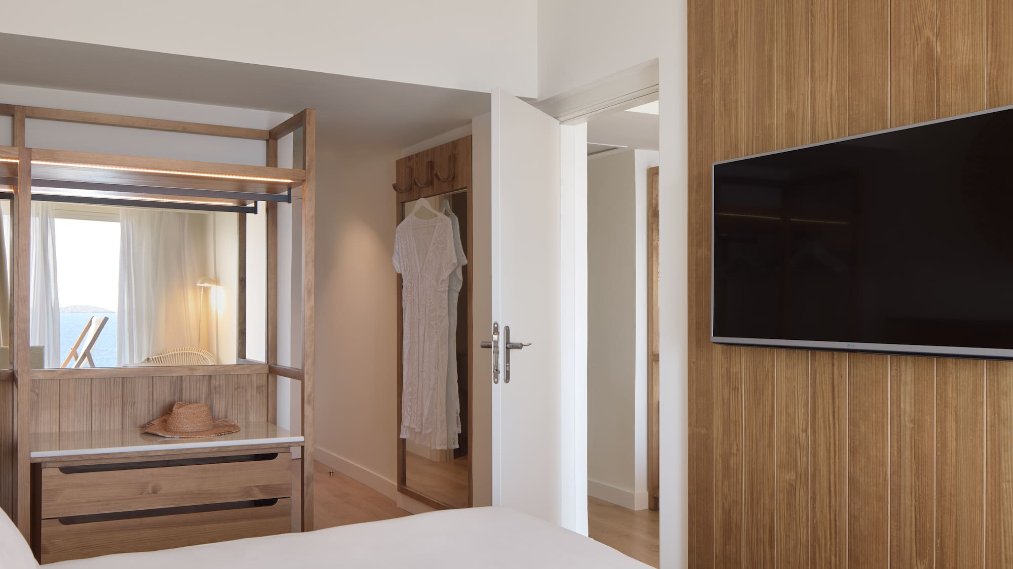 a room with a tv and a bed