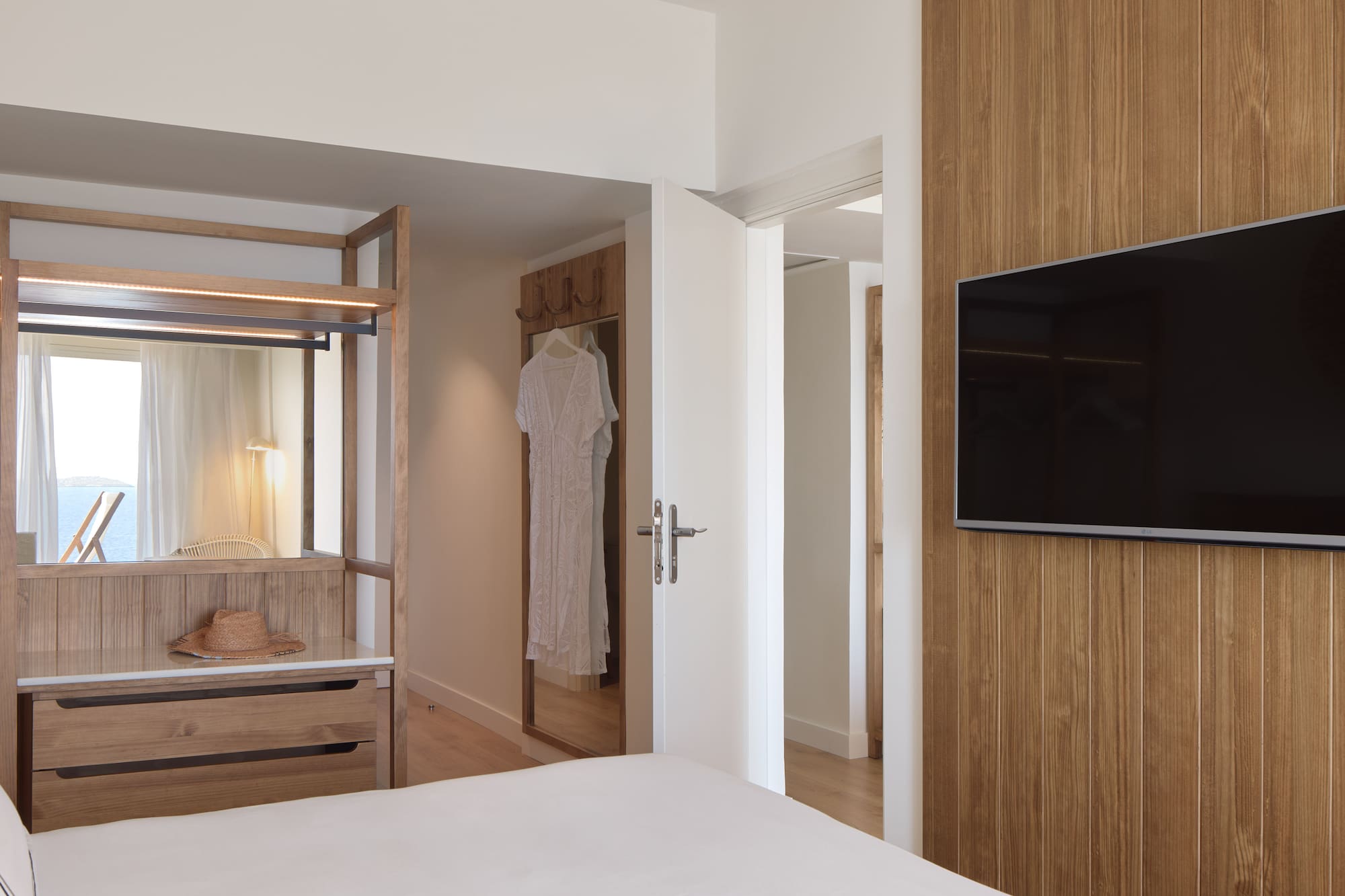 a room with a tv and a bed