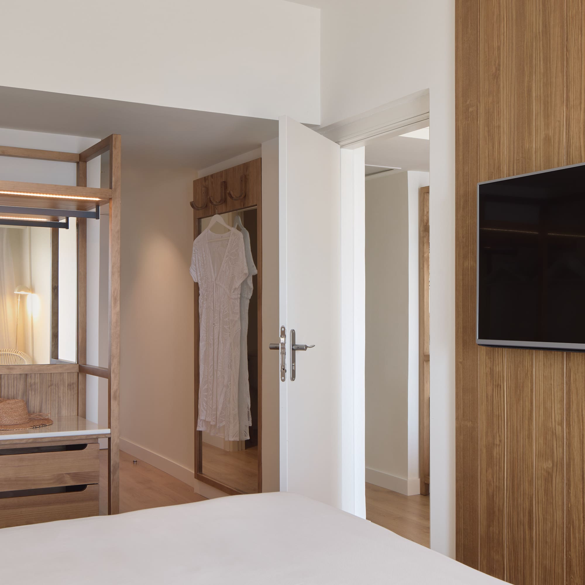 a room with a tv and a bed