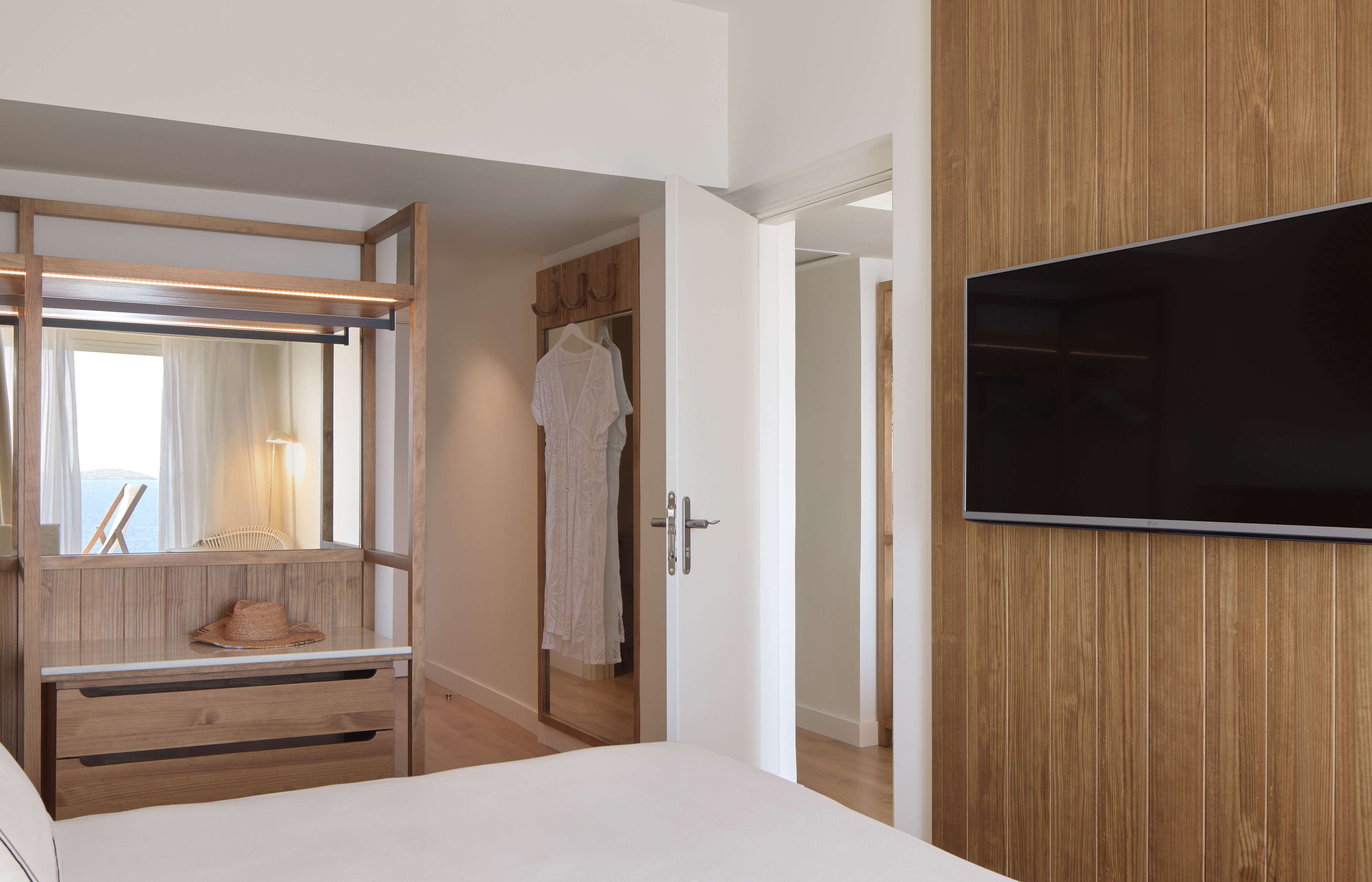 a room with a tv and a bed