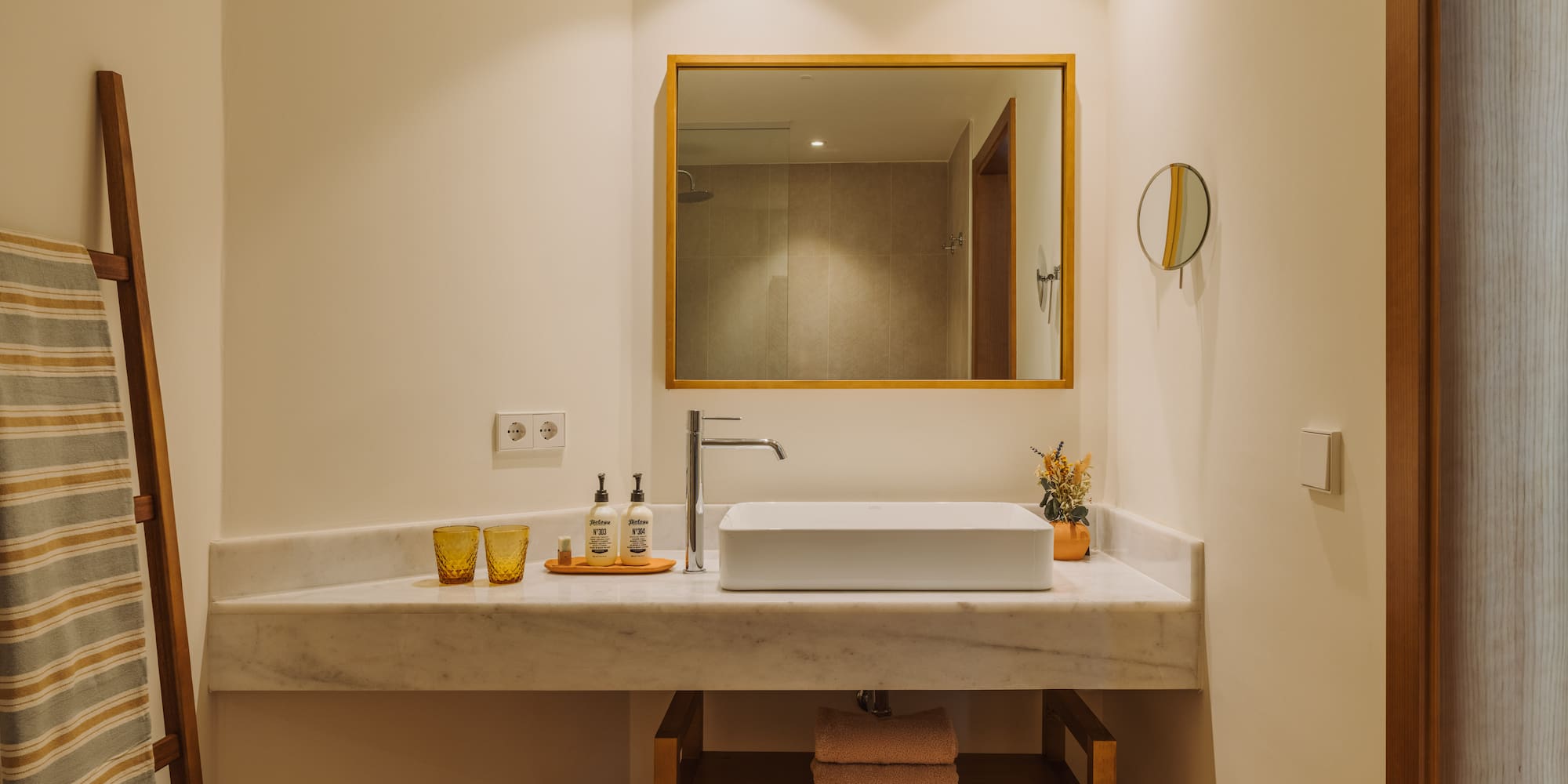 a bathroom with a mirror and sink