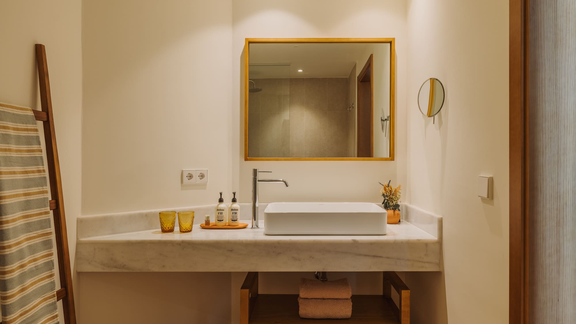 a bathroom with a mirror and sink