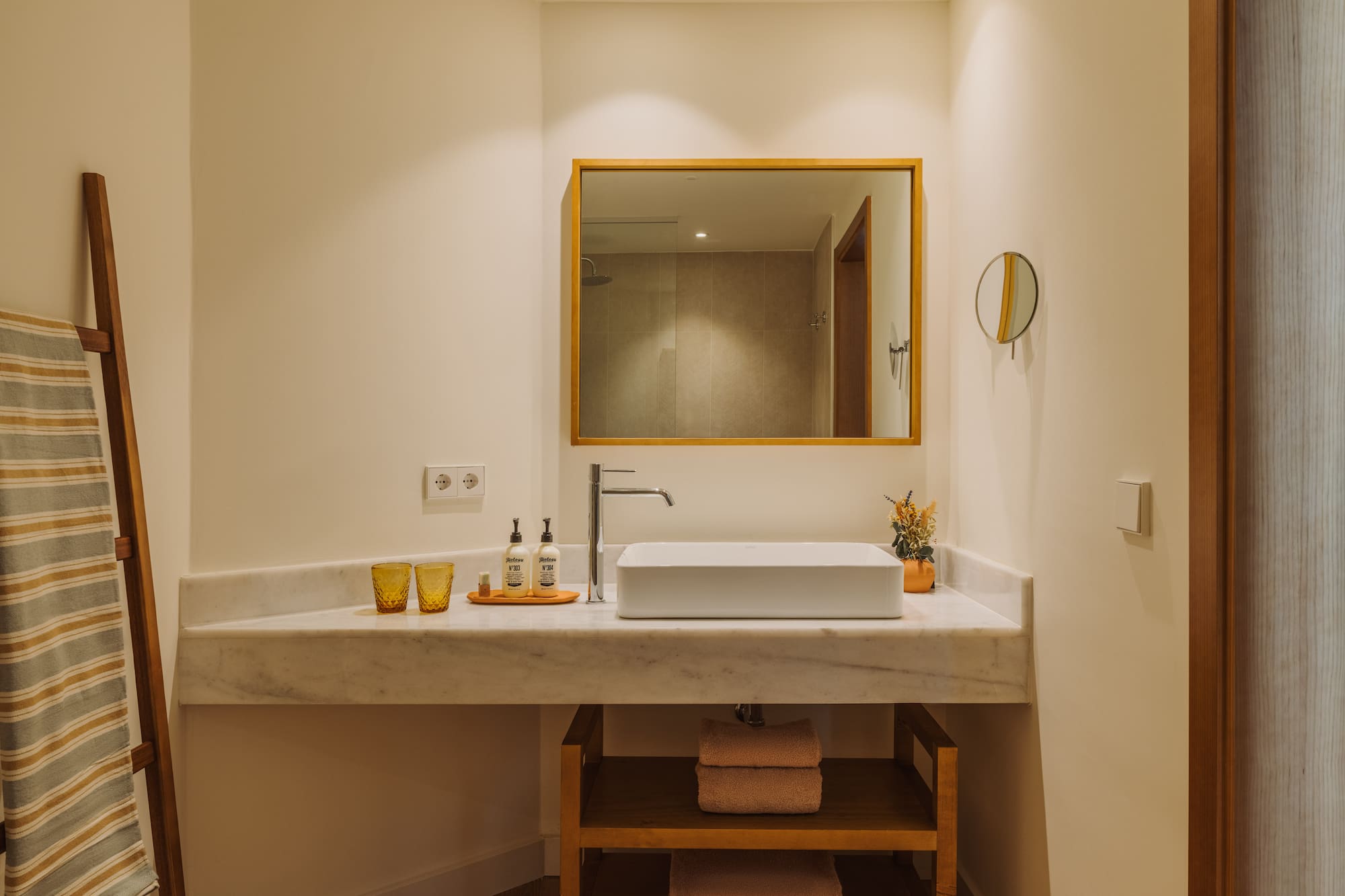 a bathroom with a mirror and sink