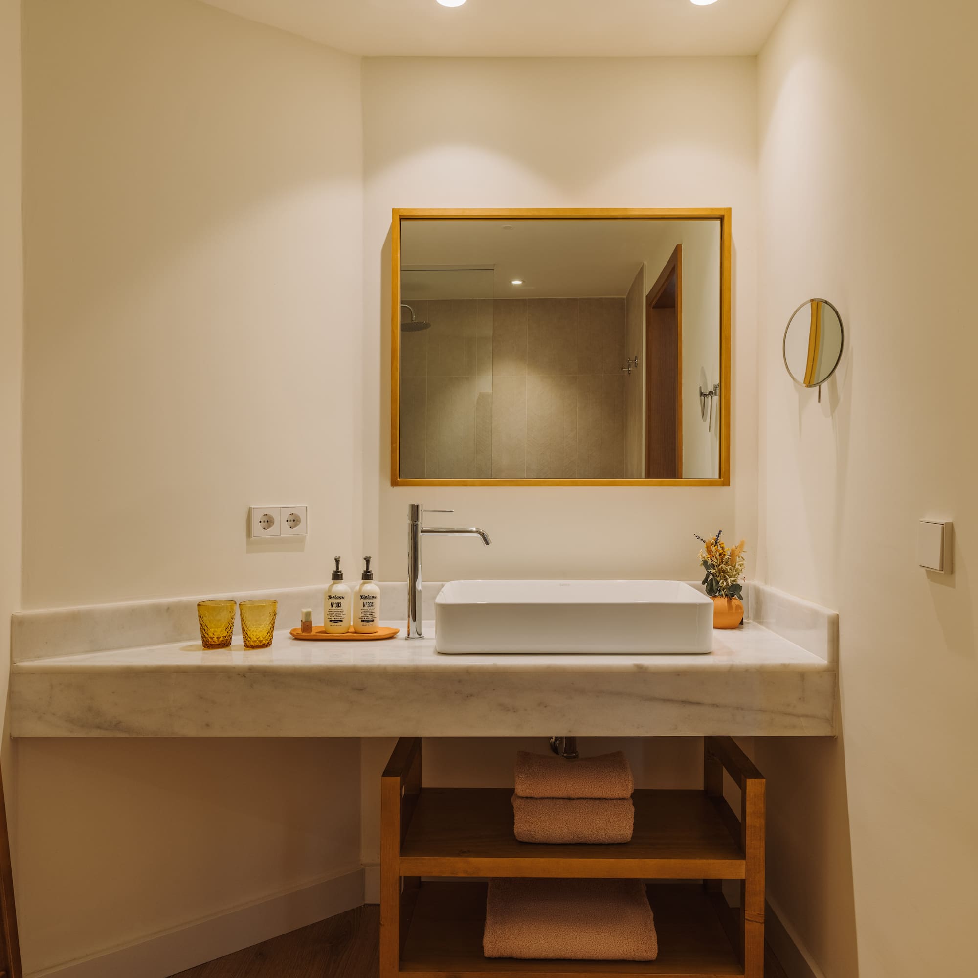 a bathroom with a mirror and sink