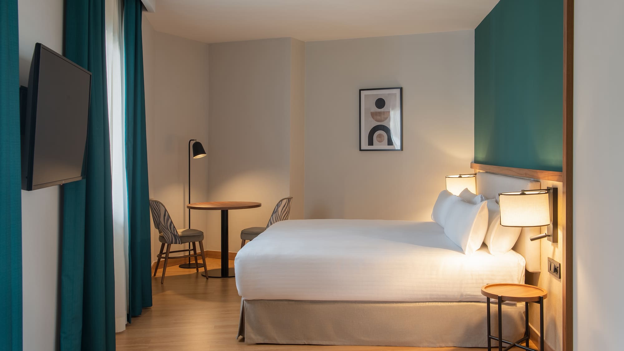 a room with a bed and table and chairs