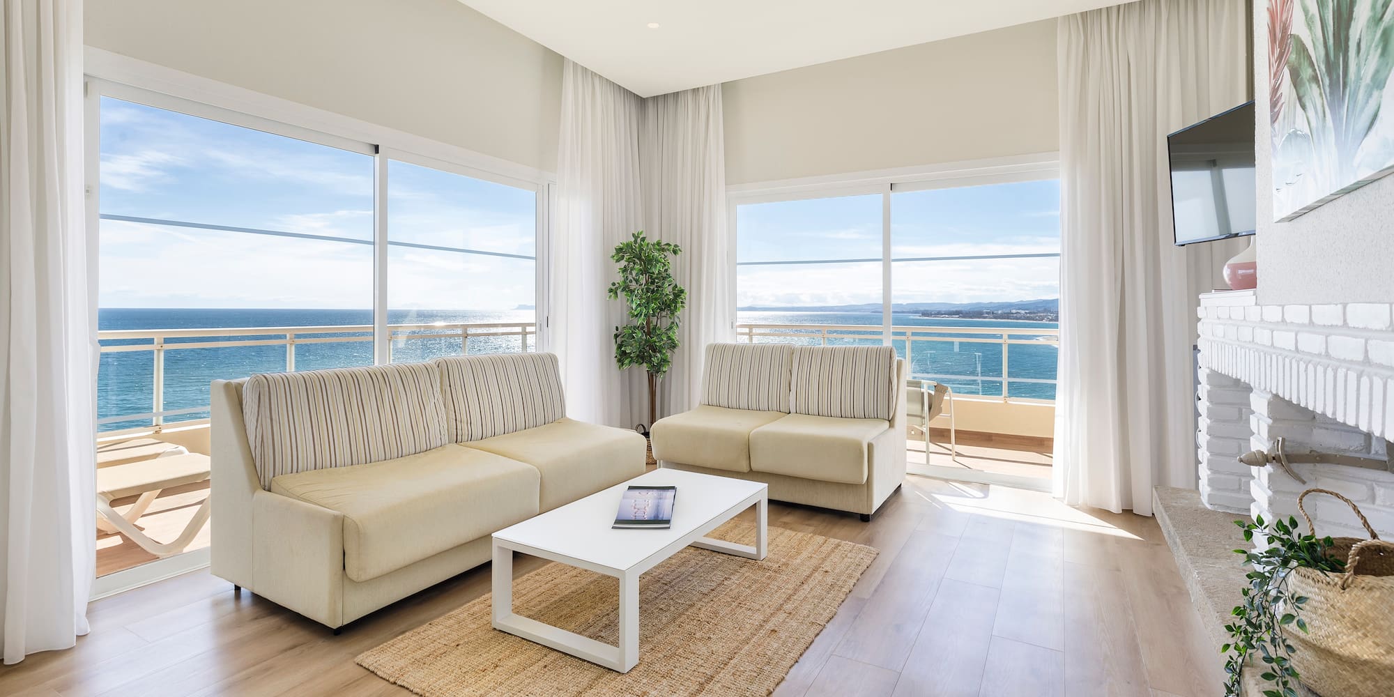 a living room with couches and a table