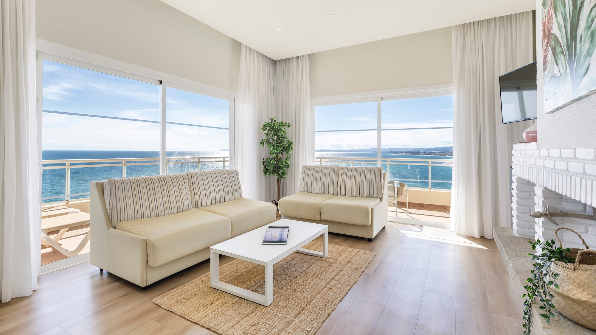 a living room with couches and a table