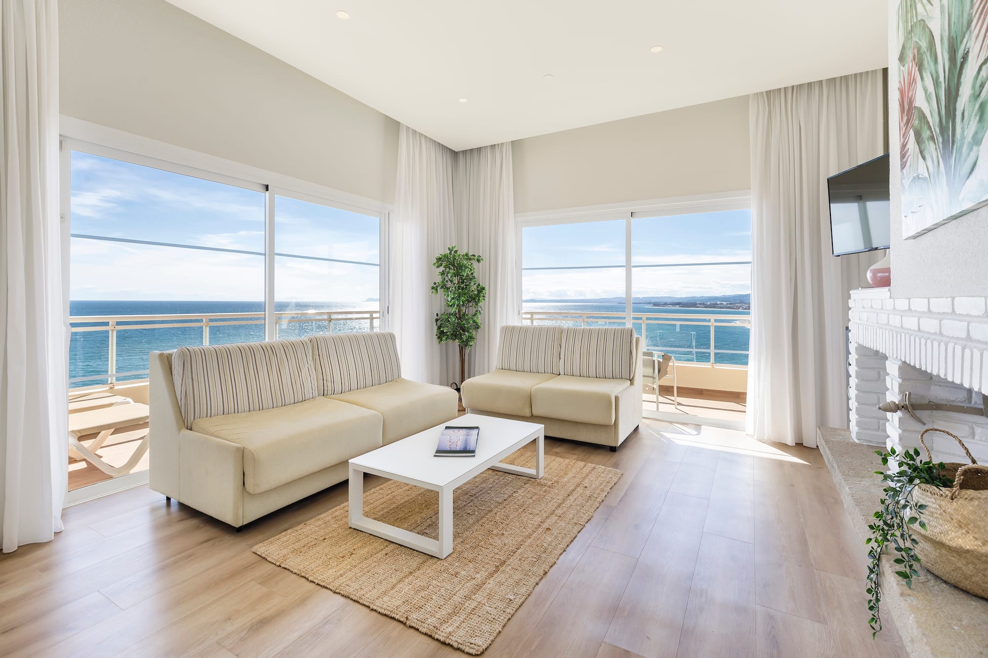 a living room with couches and a table