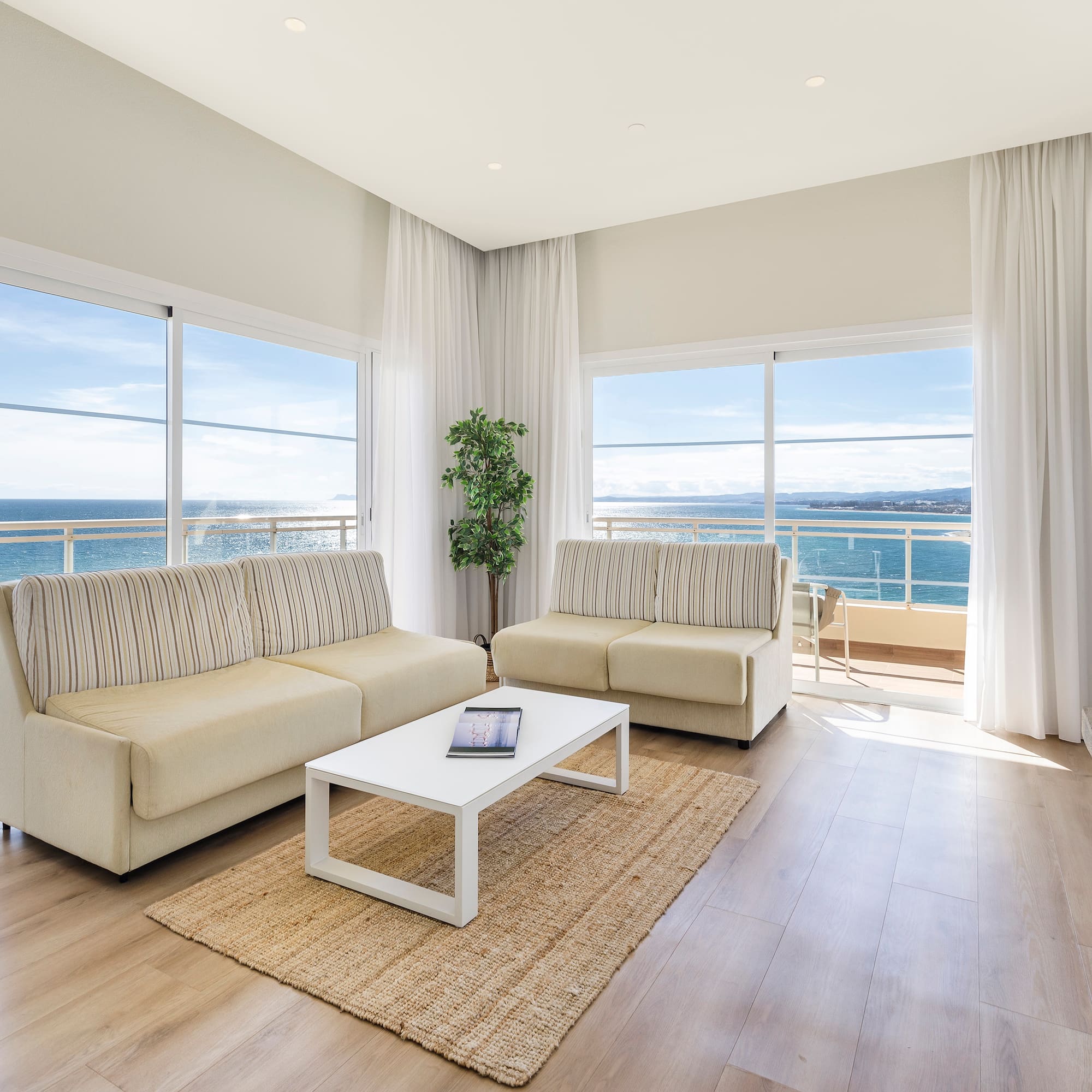 a living room with couches and a table