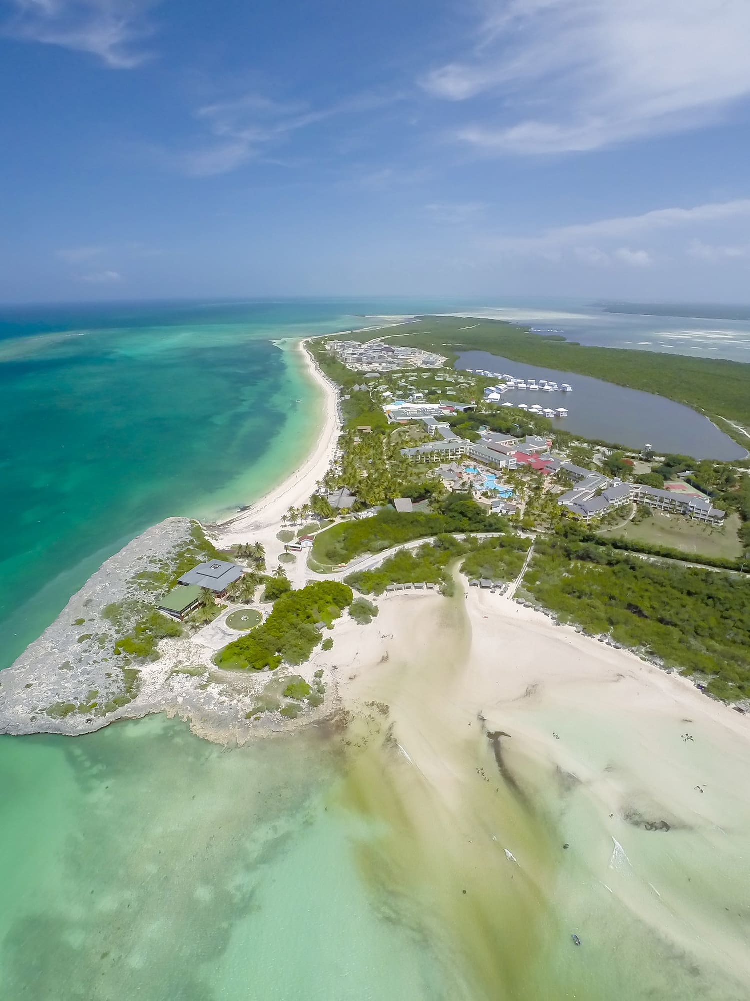 an aerial view of a beach and land