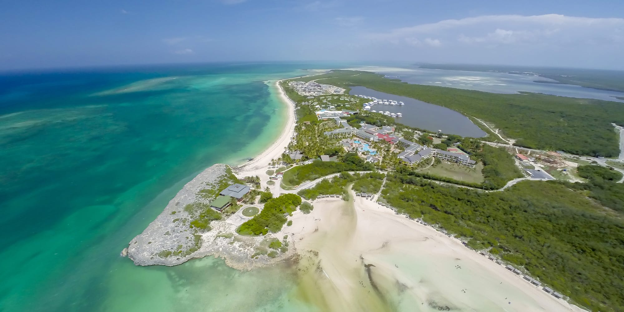 an aerial view of a beach and land