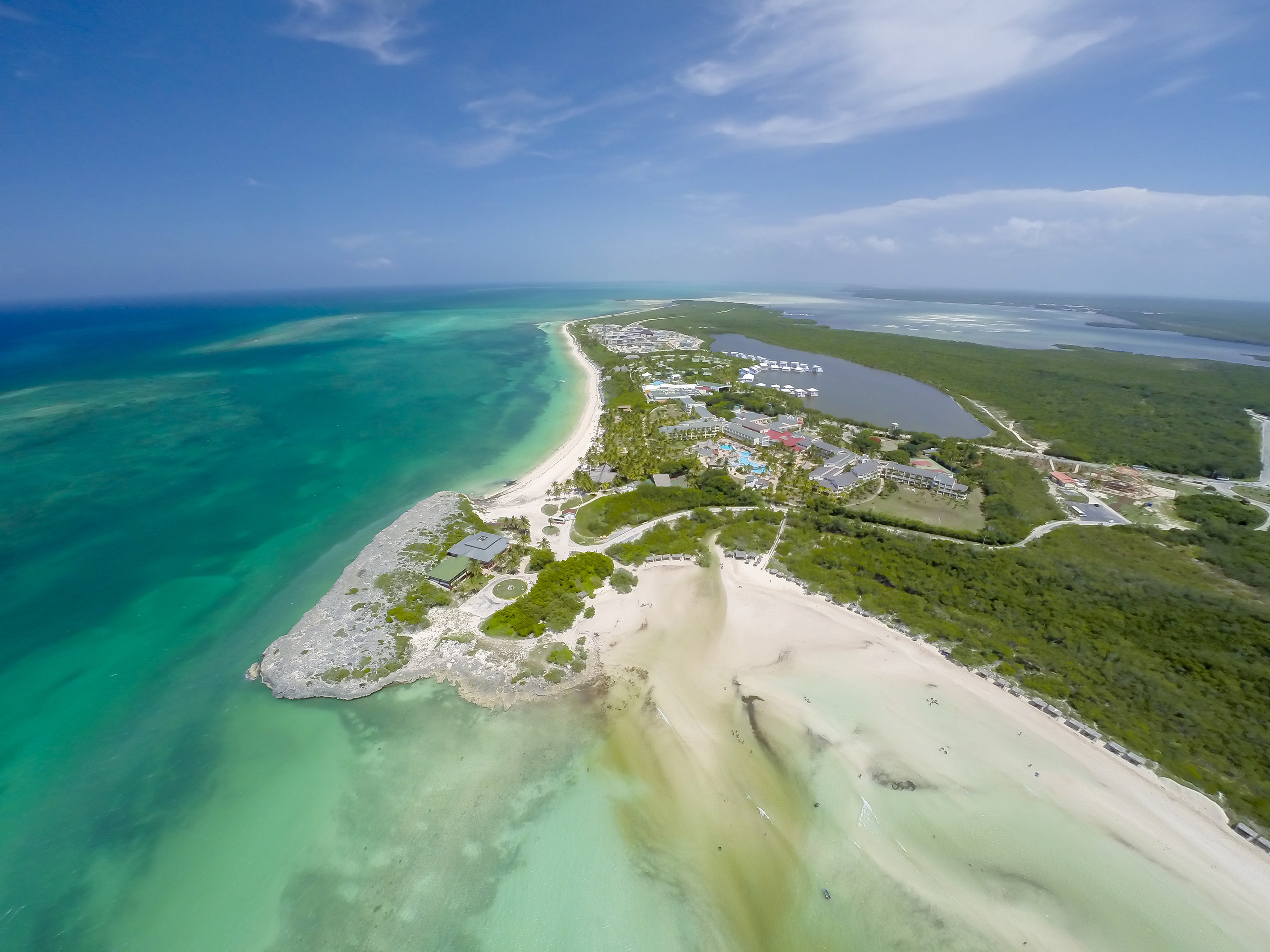 an aerial view of a beach and land