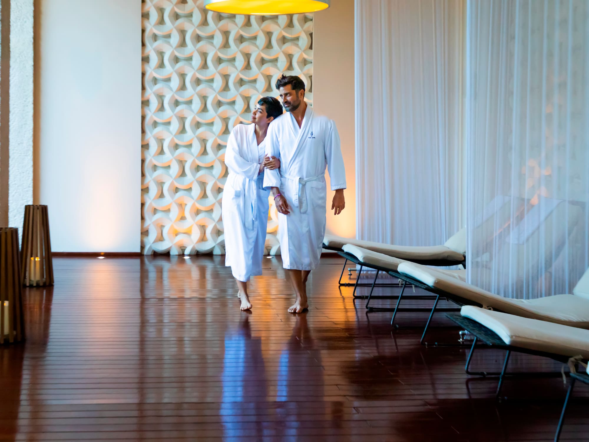 a man and woman in white robes