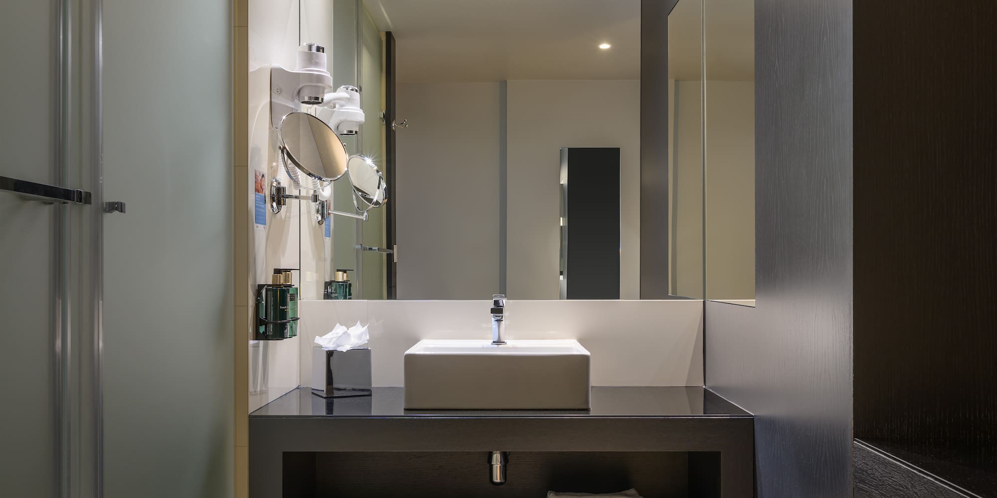 a bathroom with a sink and mirror