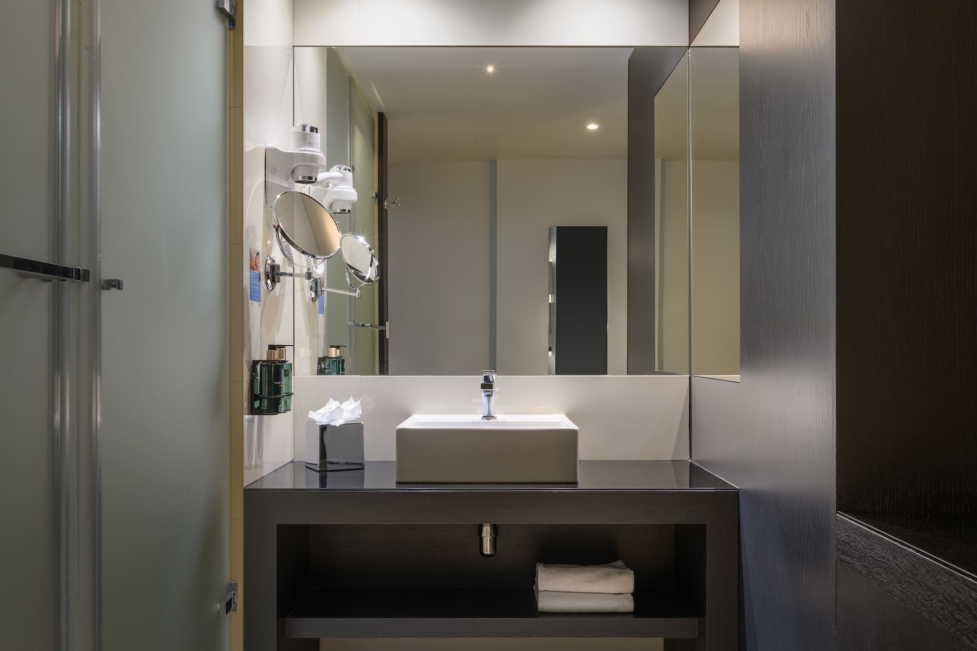 a bathroom with a sink and mirror