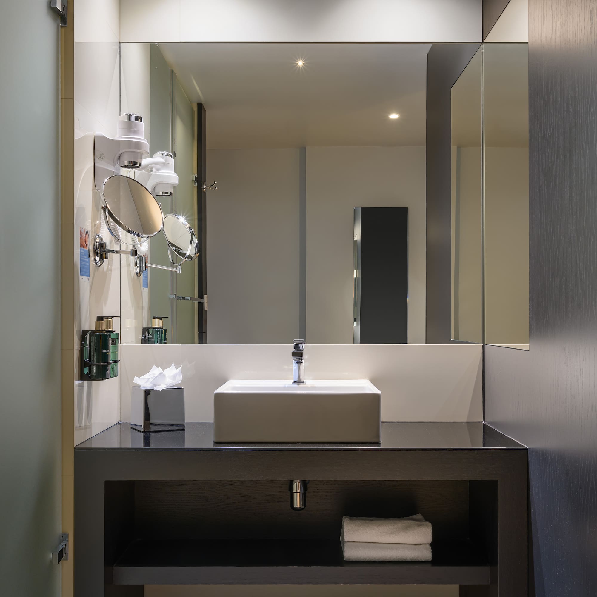 a bathroom with a sink and mirror
