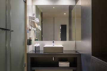 a bathroom with a sink and mirror