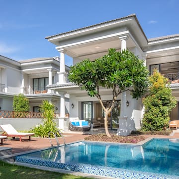 a pool in front of a house