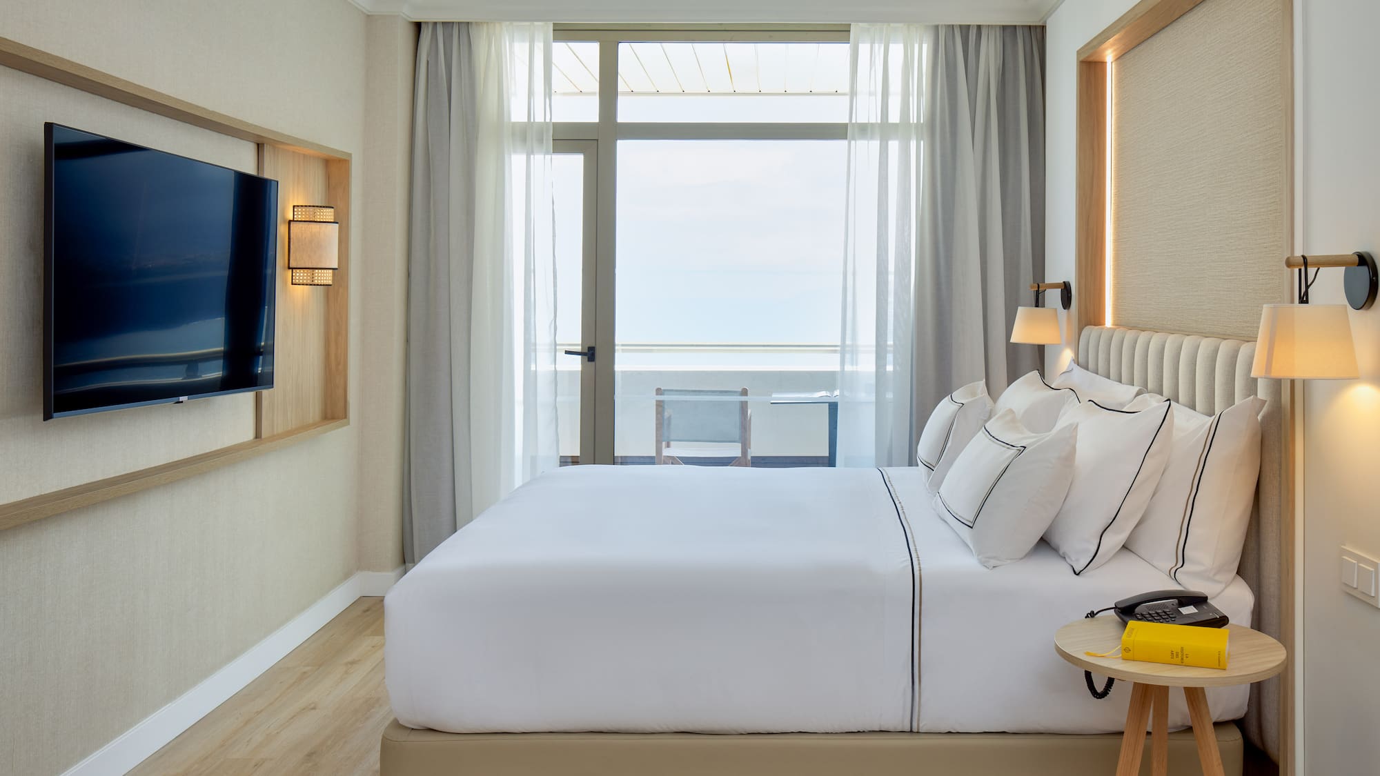 a room with a television and a bed