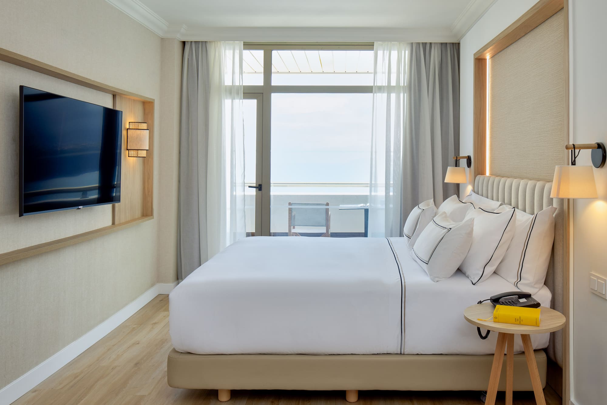 a room with a television and a bed