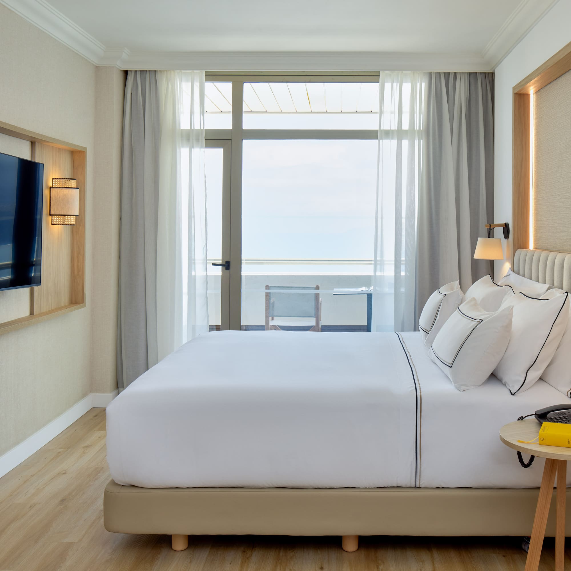 a room with a television and a bed